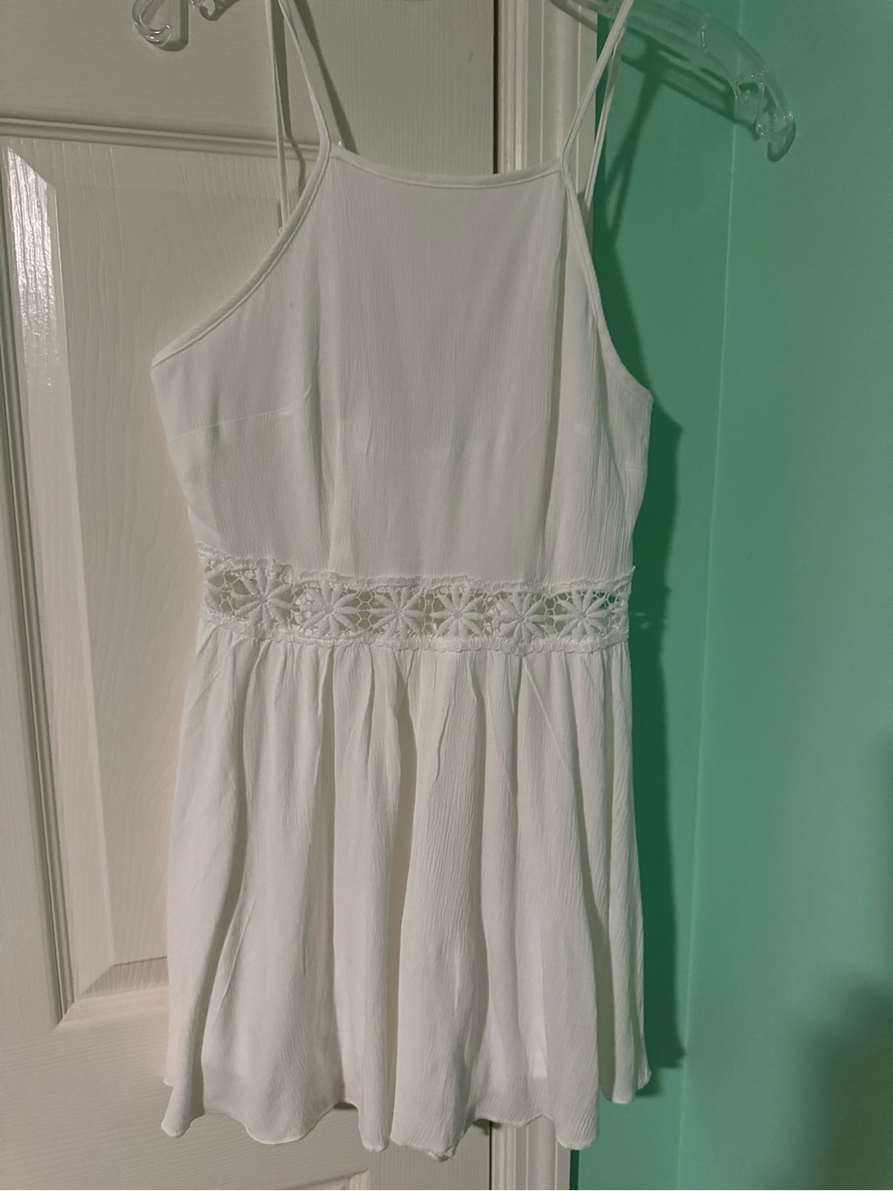Juniors romper gauzy material w lace embroidered appliqués at waist.